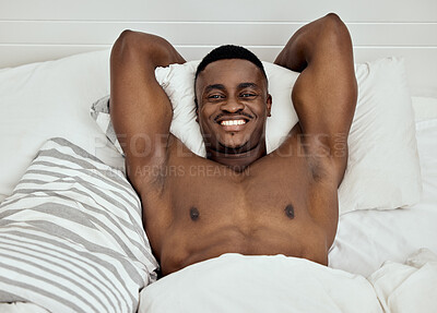 Buy stock photo Portrait, topless man and smile in bed, room and home for comfortable break, relax and good morning. Strong and happy black male wake up in bedroom from sleep, rest and stretching muscular body