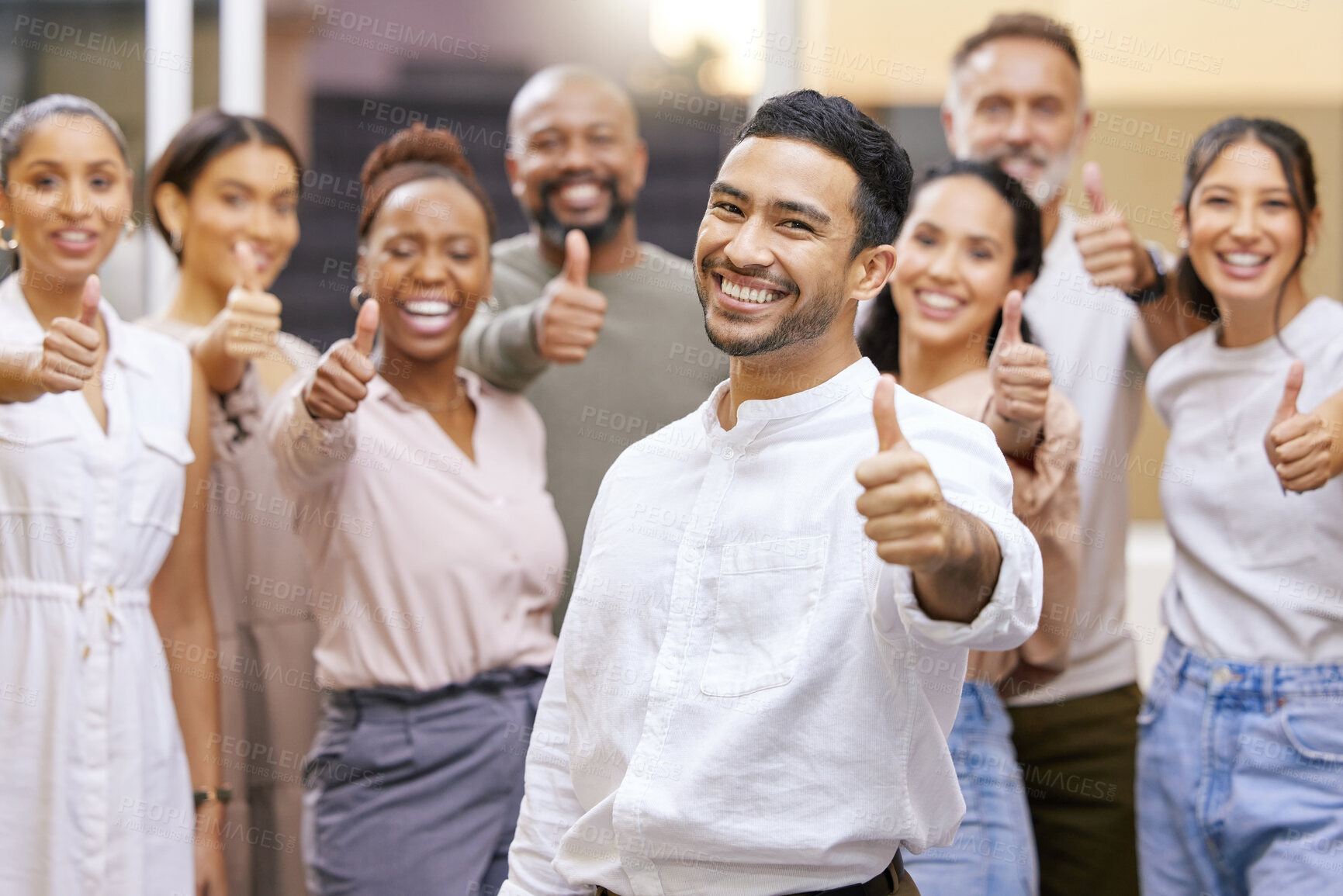 Buy stock photo Portrait of a group of businesspeople showing the thumbs up in a modern office