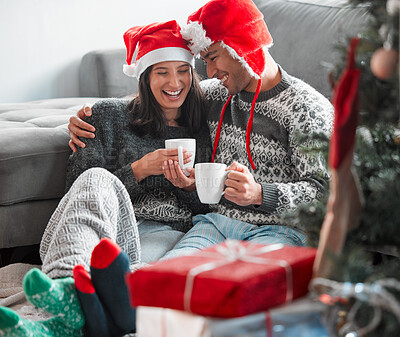 Buy stock photo Couple, christmas and coffee on sofa in living room while bonding on holiday celebration, home memory and together. Happy, man and woman on couch with gift box, care and excited or love to celebrate