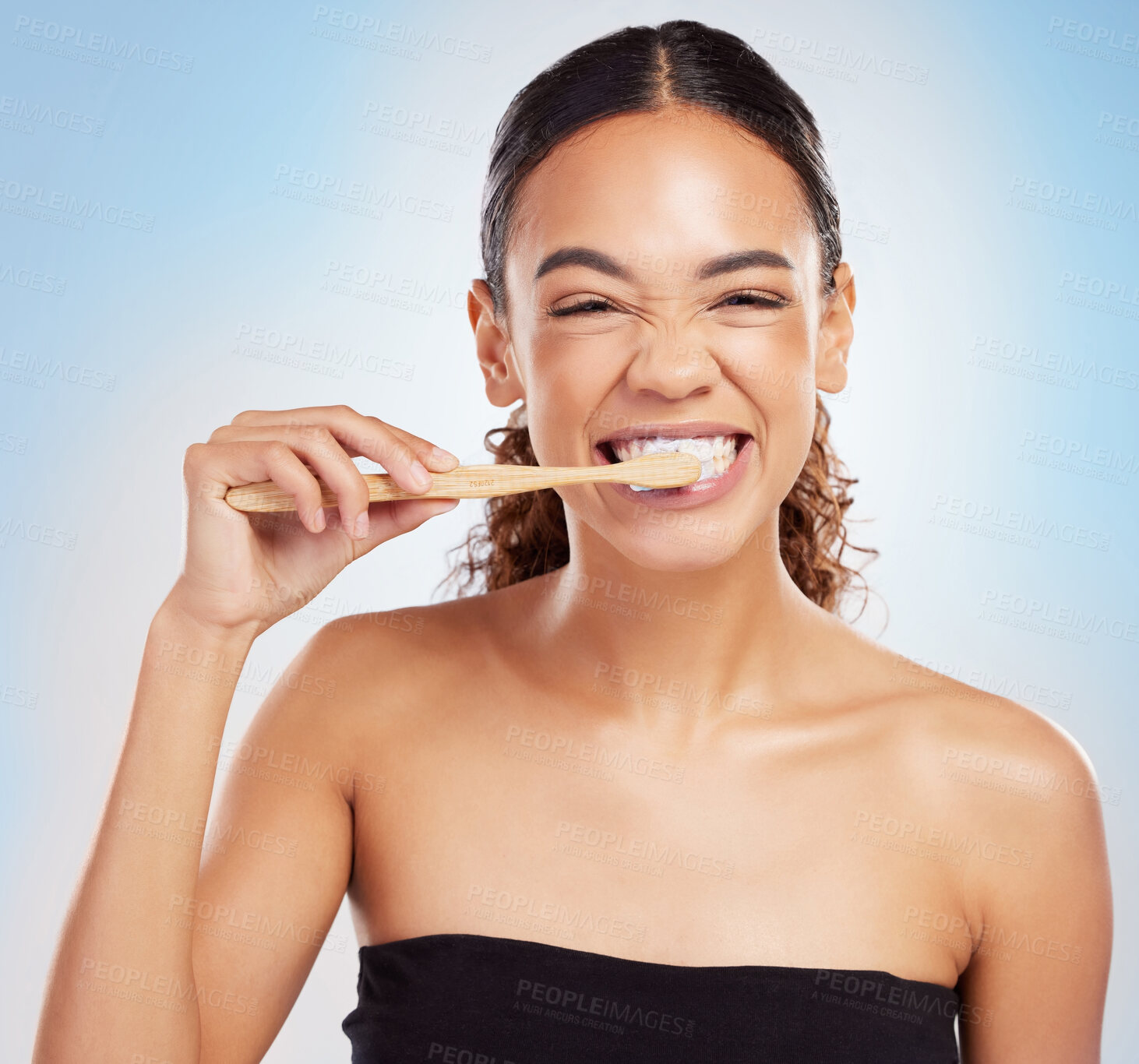 Buy stock photo Woman, portrait and toothpaste or brushing teeth in studio for healthy hygiene, dentist or blue background. Female person, face and smile self care with morning routine or oral, treatment or cleaning