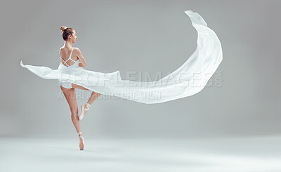 Buy stock photo Full length shot of a young ballerina dancing alone in the studio