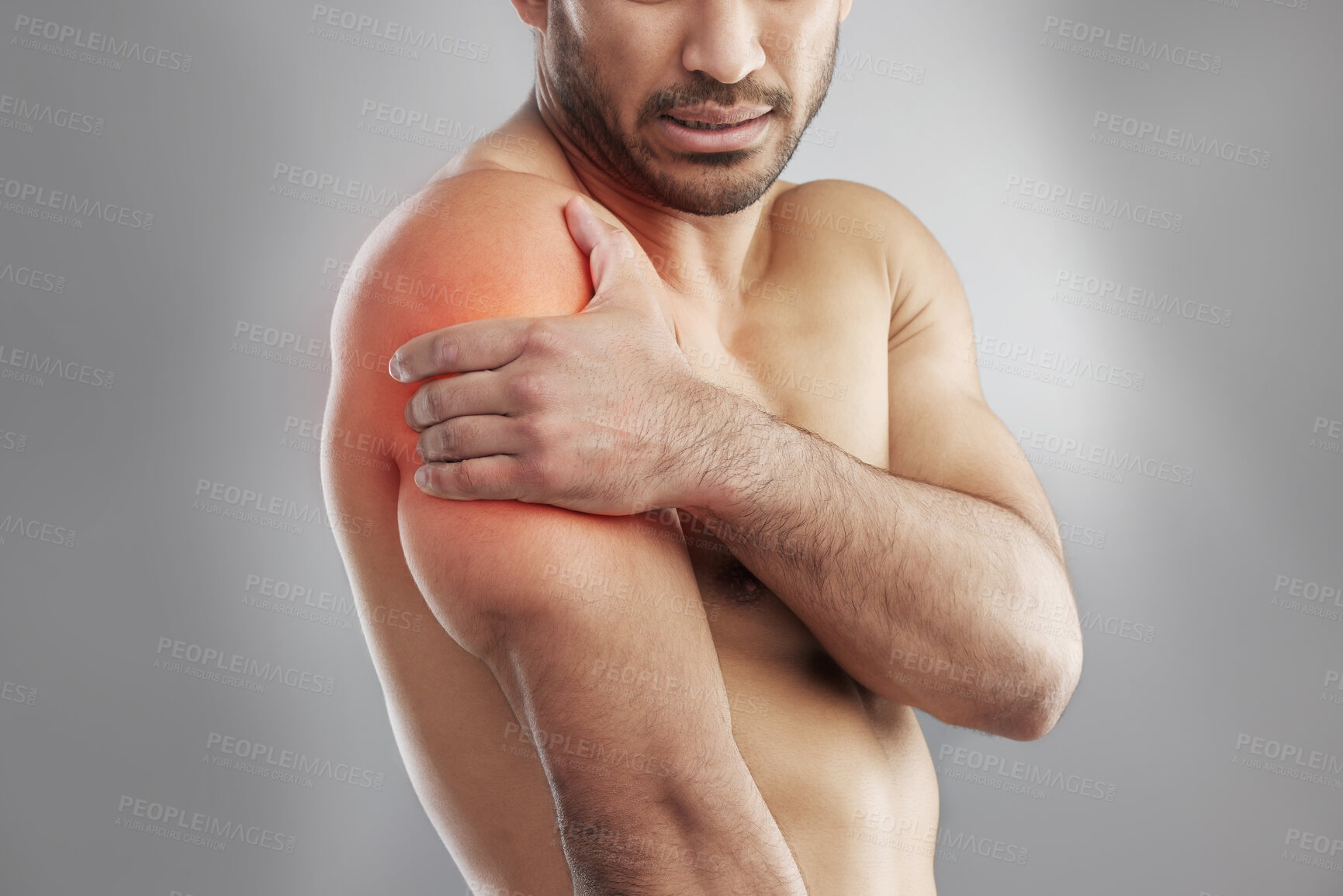 Buy stock photo Man, shirtless and shoulder injury in studio with muscle pain for physiotherapy, massage and healthcare. Fitness model, body and red glow for xray, wellness and physical therapy on gray background