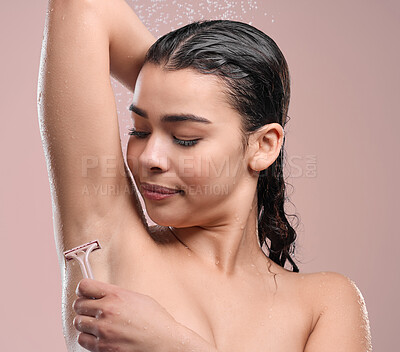 Buy stock photo Woman, razor and shave armpit in studio, pink background and happy model with water droplets. Grooming, hair removal and maintenance for body care, hygiene and wellness for skincare and clean