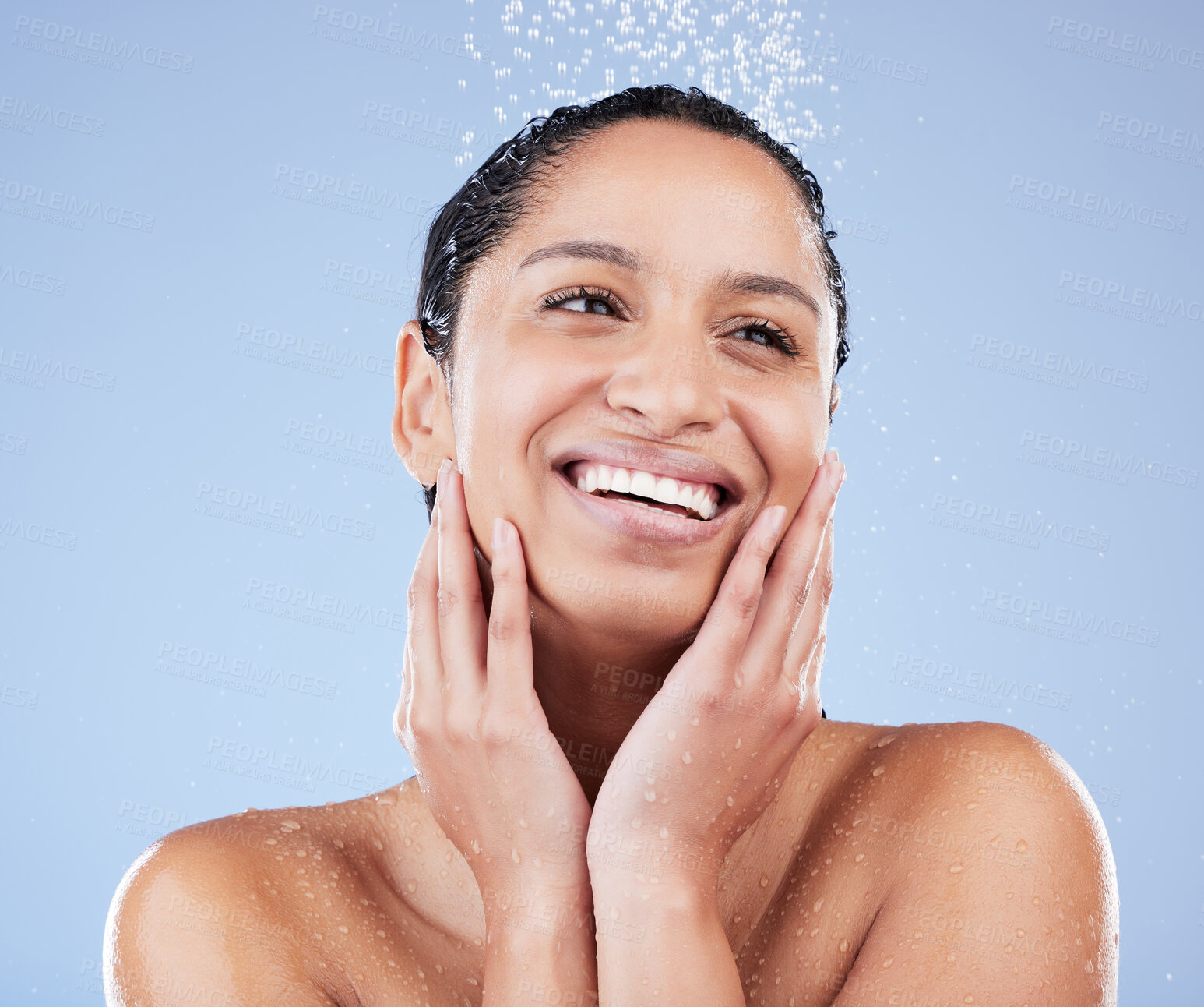 Buy stock photo Face, shower and thinking with woman in studio isolated on blue background for skincare. Beauty, idea or natural hygiene and happy model washing with water for dermatology, hydration or wellness