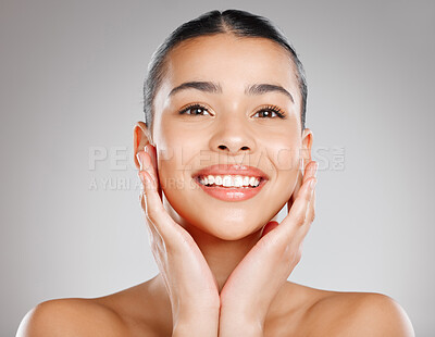 Buy stock photo Studio shot of an attractive young woman posing against a grey background