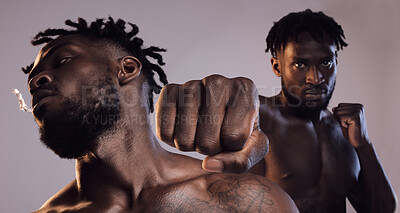 Buy stock photo Shot of two men fighting in studio against a grey background