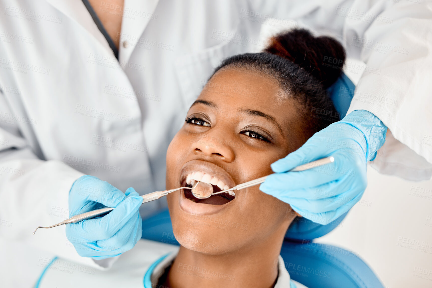 Buy stock photo Dentist, black woman and patient at a clinic with medical and healthcare for teeth cleaning. Mirror, orthodontist and African female person with wellness and dental work tool in mouth with care