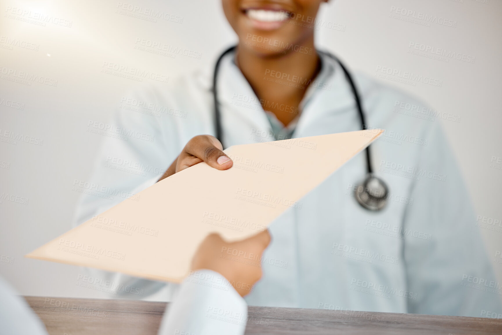 Buy stock photo Shot of a young doctor and patient going through paperwork at a clinic