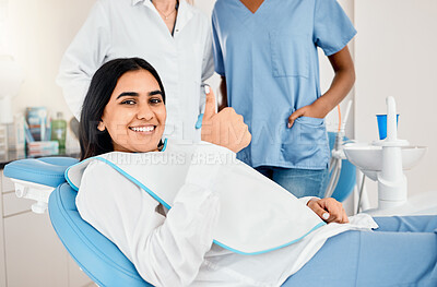 Buy stock photo Shot of a young woman in her dentists office giving the thumbs up