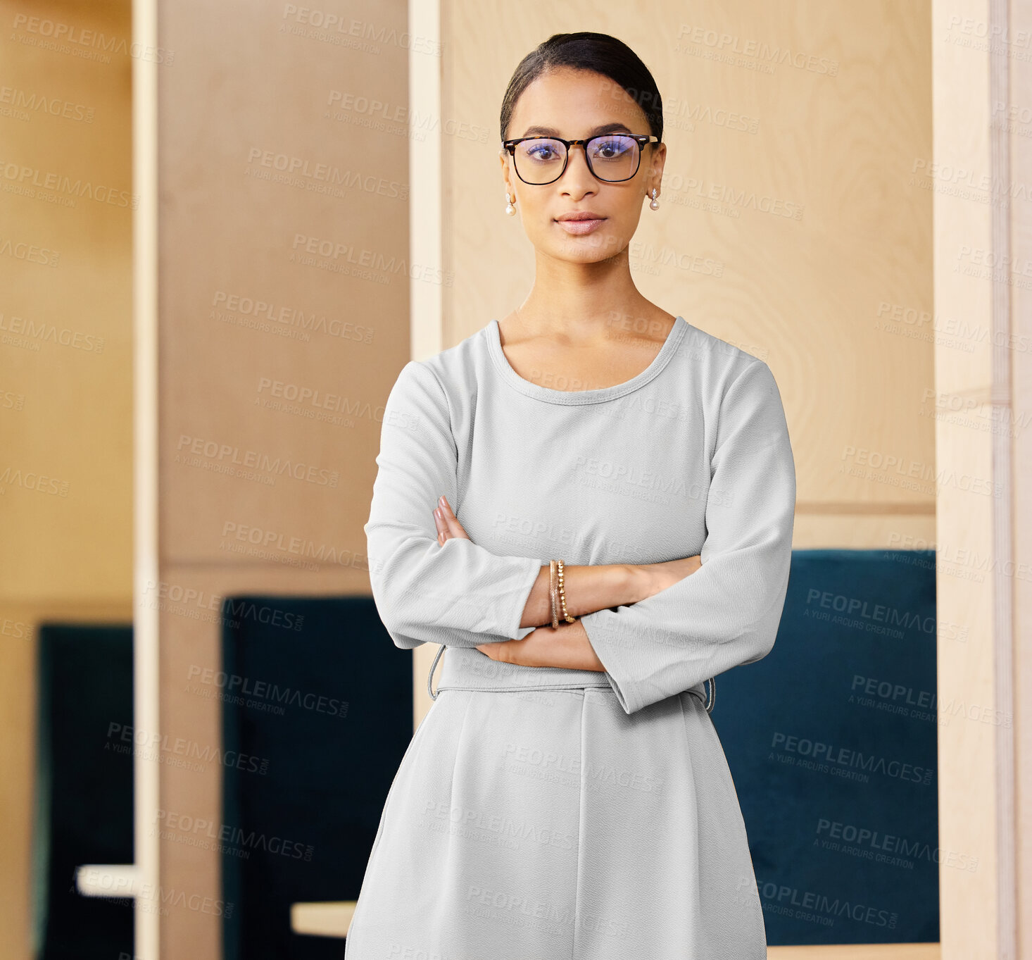 Buy stock photo Cropped portrait of an attractive mature businesswoman standing with her arms crossed in the office