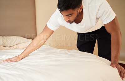 Buy stock photo Home, man and bed with cleaning in morning for maintenance, daily routine or change of duvet. Furniture, mattress and male person with housekeeping in bedroom for  fresh fabric, wellness and hygiene
