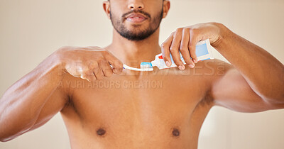 Buy stock photo Hands, toothpaste on toothbrush with man and dental, oral health and wellness with brushing teeth. Fresh breath, hygiene and grooming with male person cleaning mouth, self care and morning routine