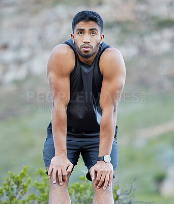 Buy stock photo Runner, tired and man with fitness in nature for cardio exercise, challenge and training for marathon. Outdoor, exhausted and male athlete with run pause for workout, fatigue and breathe in Morocco