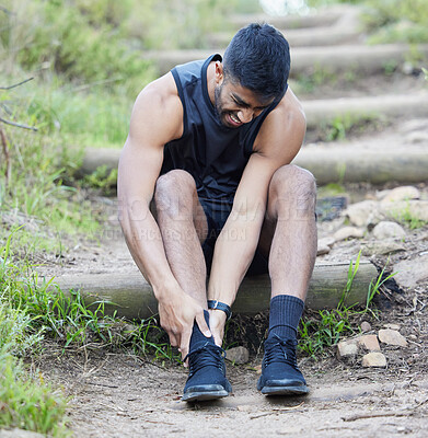 Buy stock photo Fitness, man or runner with ankle pain in forest to exercise, body training injury or outdoor workout. First aid, achilles and injured sports athlete suffering on broken foot in running emergency