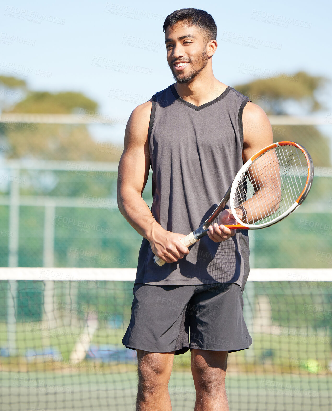 Buy stock photo Playing, happy or Indian man on tennis court for fitness training, workout or sports exercise outdoors. Wellness, thinking and healthy athlete with smile or racket to start challenge in game or match