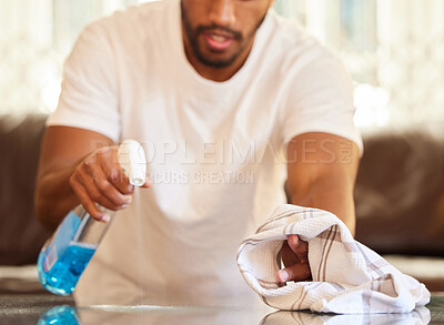 Buy stock photo Man, clean table with chemical and cloth, detergent spray and wipe dirt from furniture. Housekeeping, male person cleaning home with bottle and disinfecting surface from bacteria with hygiene 