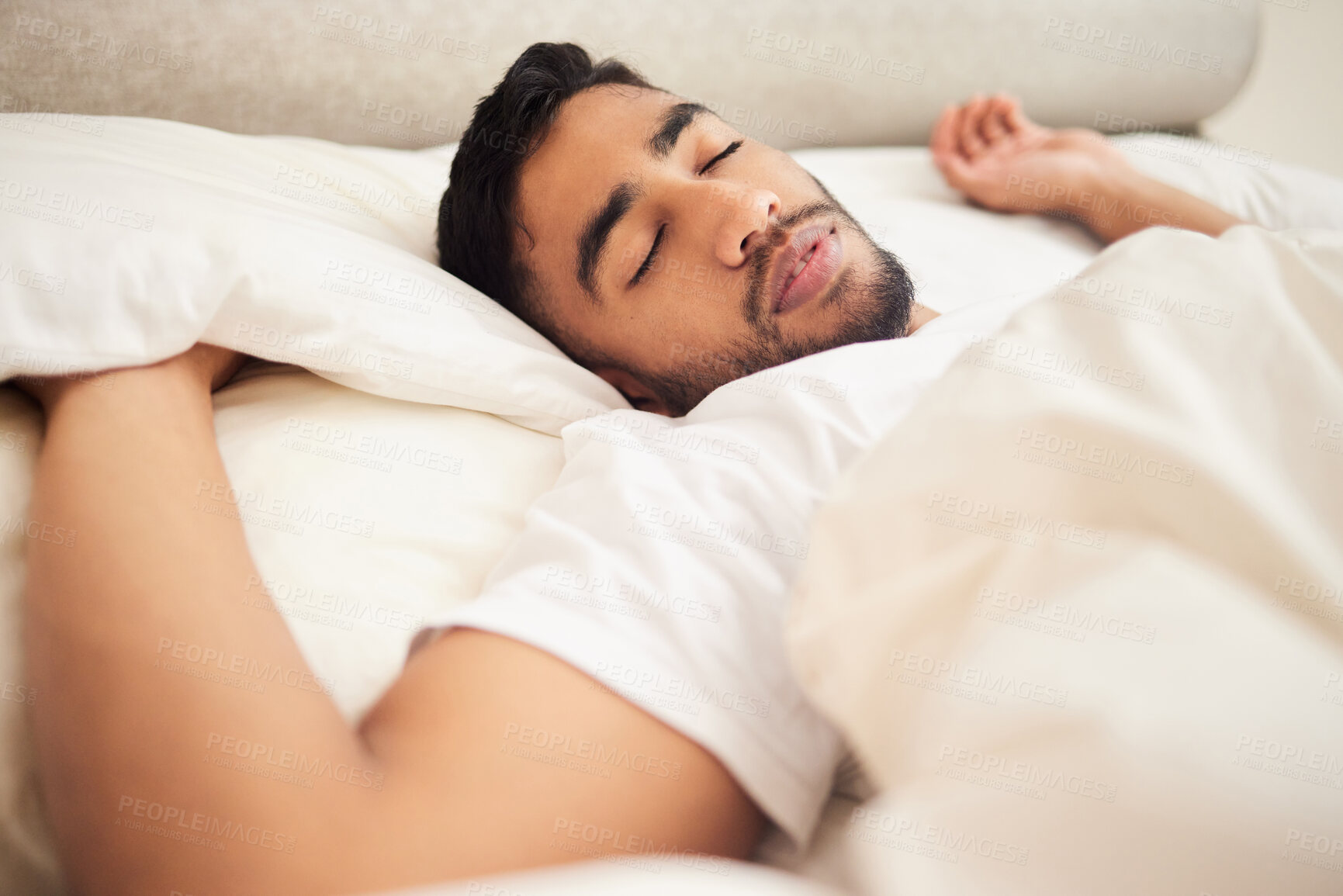 Buy stock photo Sleep, relax and peace, face of man in bed with pillow and duvet in morning, fatigue and calm in house. Health, wellness and sleeping, tired male in bedroom and time to rest or dream in home comfort.