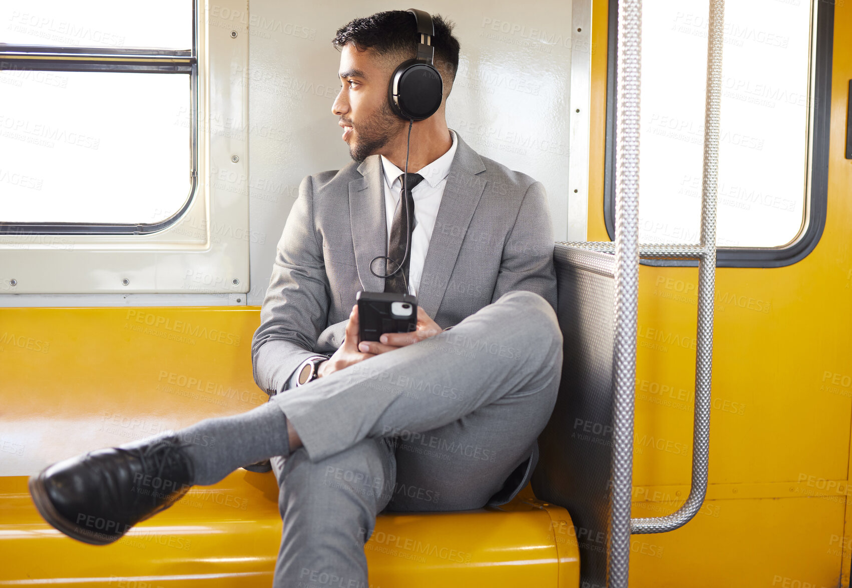 Buy stock photo Metro travel, businessman and headphones with music listening, radio and podcast to work. Subway, corporate professional and relax with transport and web audio on railway track and urban transit