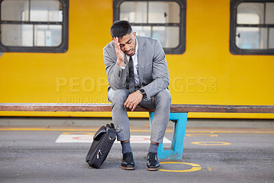 Buy stock photo Fatigue, stress and businessman at train station with headache, pain and burnout from work pressure. Exhausted, frustrated and overworked man sitting on bench on subway platform for metro transport.