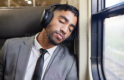 Buy stock photo Music, sleeping and business man in train exhausted, nap or resting with headphones while traveling. Work, commute and indian male person with earphones for radio while traveling, burnout or fatigue