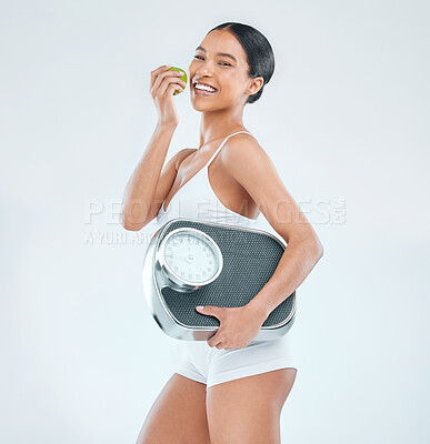 Buy stock photo Health, scale and portrait of woman for diet, apple and nutrition on white background. Weight loss, food and vitamins or fruit for fibre and wellness, benefits and studio and female model or athlete