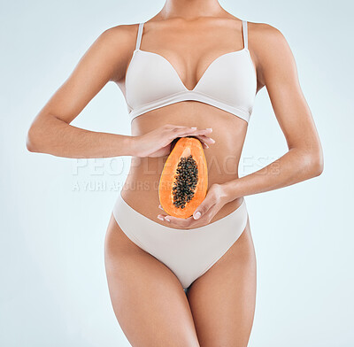 Buy stock photo Health, diet and woman with fruit, food and nutrition on white background. Weight loss, papaya and vitamins or vegan for fibre and wellness dietician, benefits or digestion in studio and female model