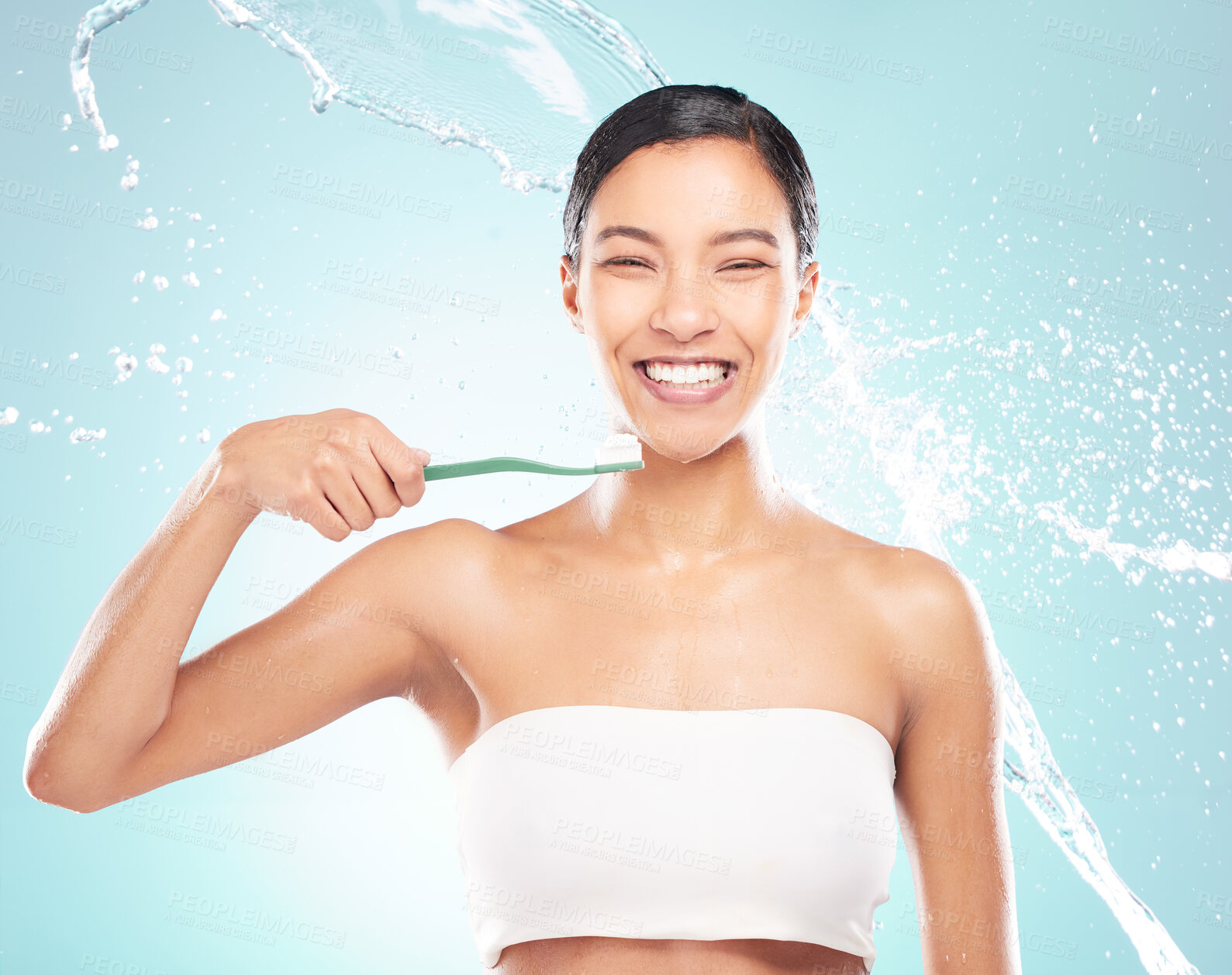 Buy stock photo Happy woman, portrait and teeth with toothpaste for dental care or hygiene on a blue studio background. Female person or model with smile, water splash or toothbrush for hydration, oral or gum health