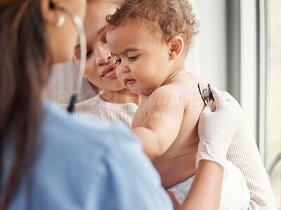 Buy stock photo Shot of a doctor listening to a baby's chest with her stethoscope