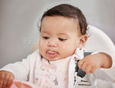 Buy stock photo High chair, food and real baby eating with bowl for health, growth development and delicious lunch or breakfast at home. Hungry newborn child or girl with healthy product, nutrition and learning