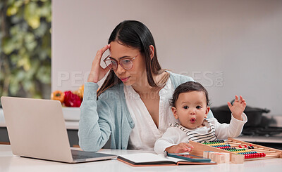 Buy stock photo Shot of a young mother looking stressed while working from home