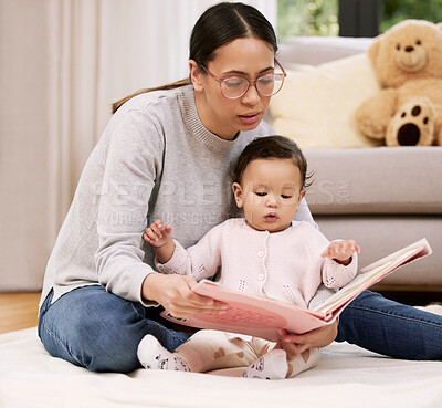 Buy stock photo Baby, mama and reading book for learning in home, bonding and care, love or relax. Mother, newborn child and storytelling for education, teaching or studying fantasy fairytale together in living room