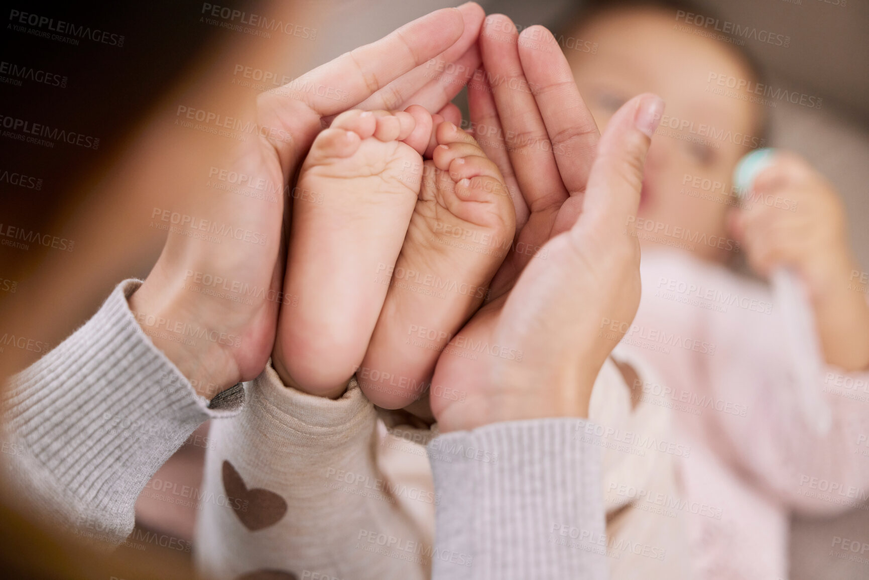 Buy stock photo Hands, baby and mom holding feet with child for development, care and support in family home. Mother, newborn and together with connection, love and trust with parent and legs in apartment or bedroom