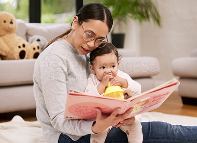 Buy stock photo Mom, baby and reading book for learning in home, bonding and care, love or relax. Mother, newborn child and storytelling for education, teaching or studying fantasy fairytale together in living room.