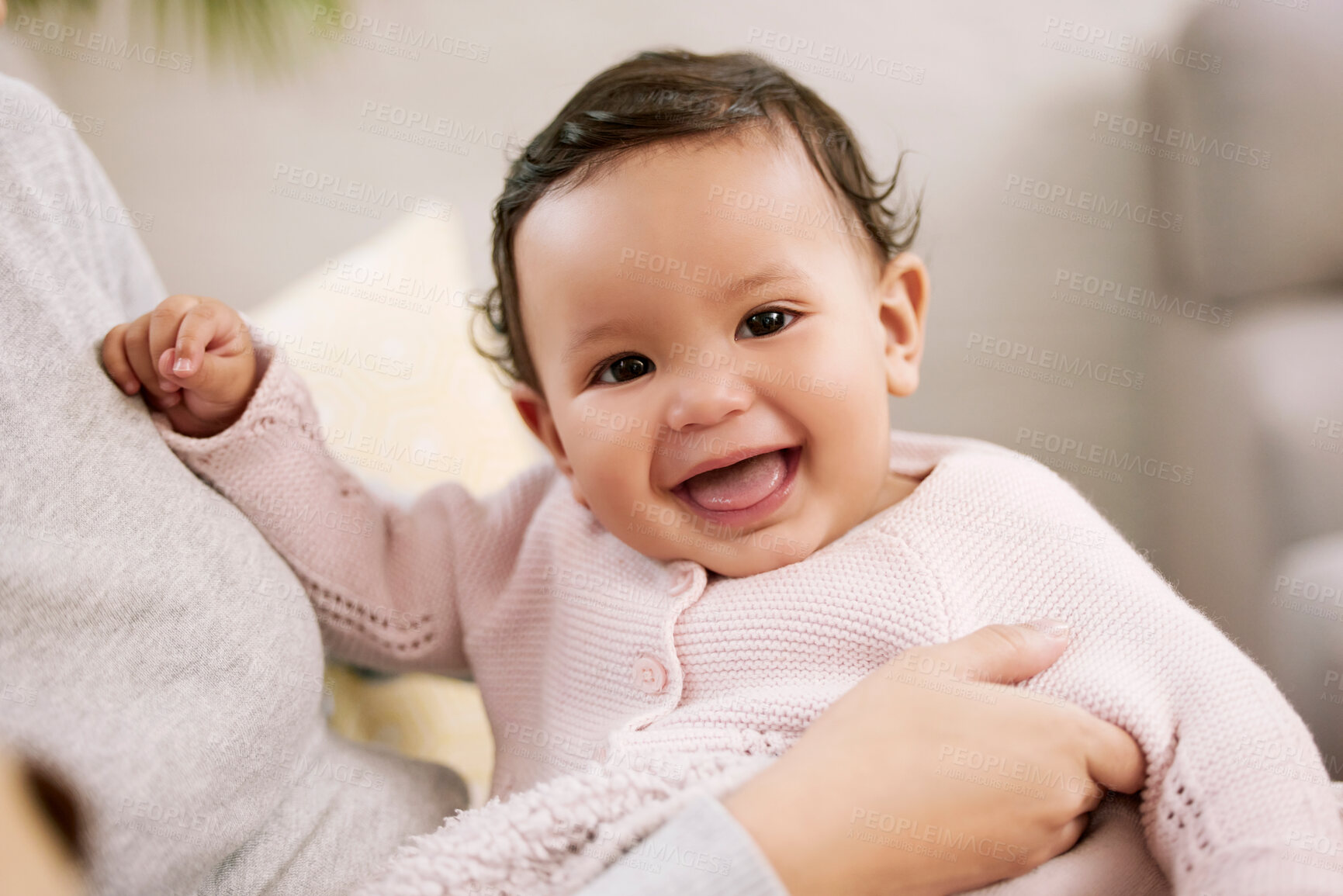 Buy stock photo Shot of a woman holding her baby at home