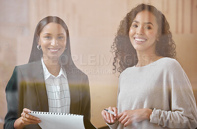 Buy stock photo Shot of two businesswoman having a conversation