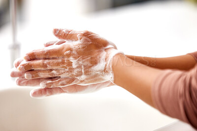 Buy stock photo Cleaning, hands and person with foam or soap in home, kitchen or bathroom for protection from bacteria. Washing, skincare and self care closeup with hygiene, safety and healthy routine in house