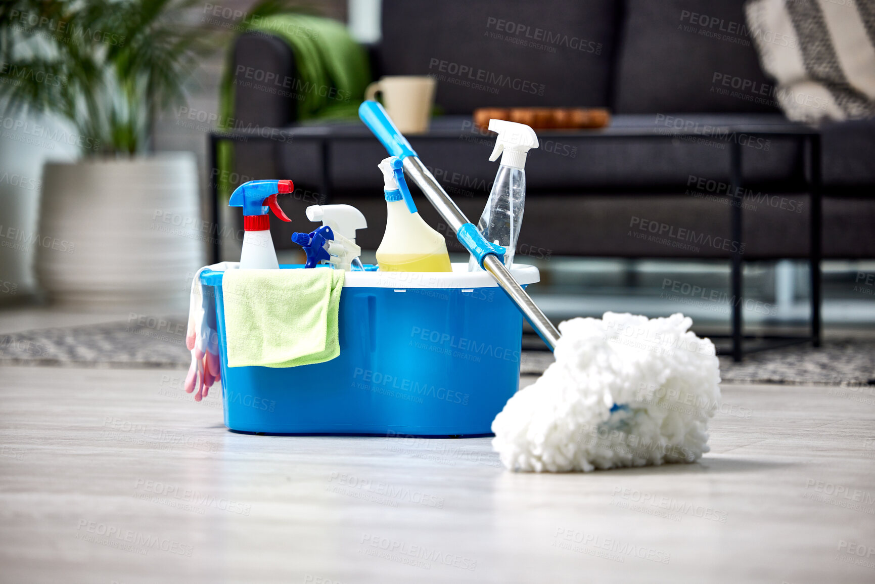 Buy stock photo Cleaning, detergent and mop on the floor of a living room in a home for hygiene or service during housework. Product, bacteria and safety with supplies in a bucket ready to clean a house for service