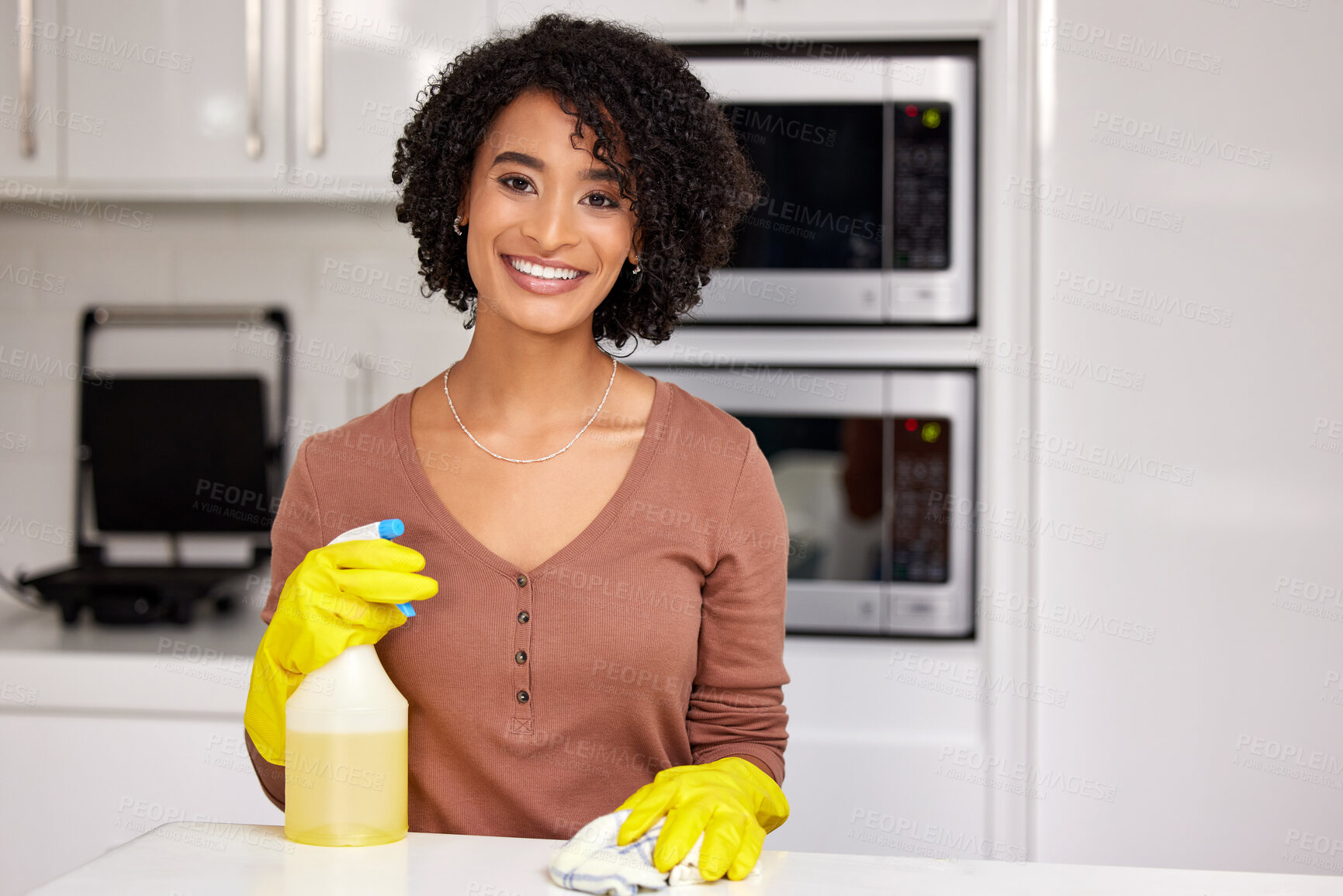 Buy stock photo Black woman, portrait and cleaning counter in kitchen, wipe glass and spray chemicals for hygiene. Female person, maid and maintenance service in apartment, soap and disinfection detergent to tidy