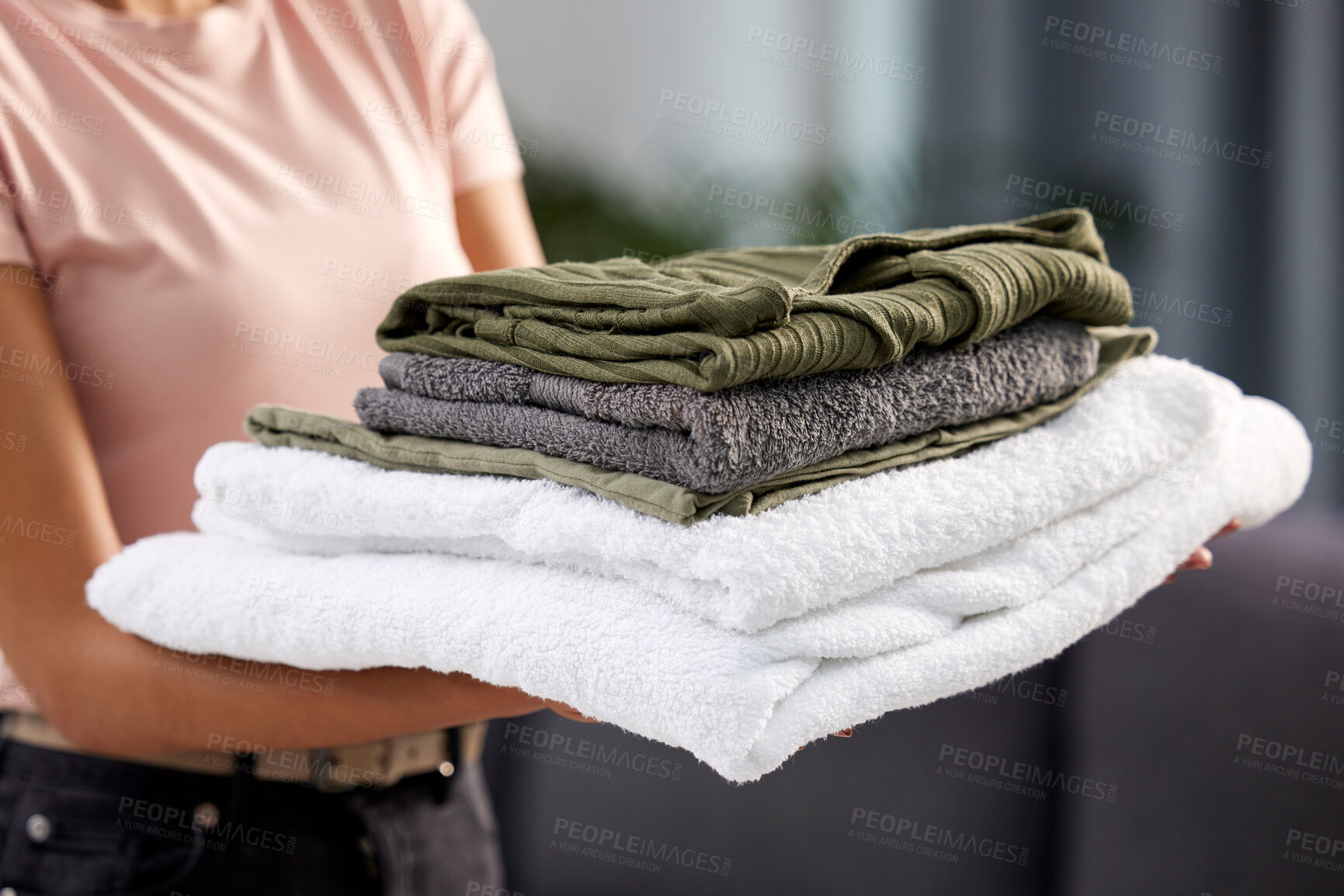 Buy stock photo Home, clean laundry and woman with pile, linen and hospitality with fabric towel, texture or housekeeping. Person, lady or girl in lounge, closeup or cotton textile with stack, cleaner or hospitality