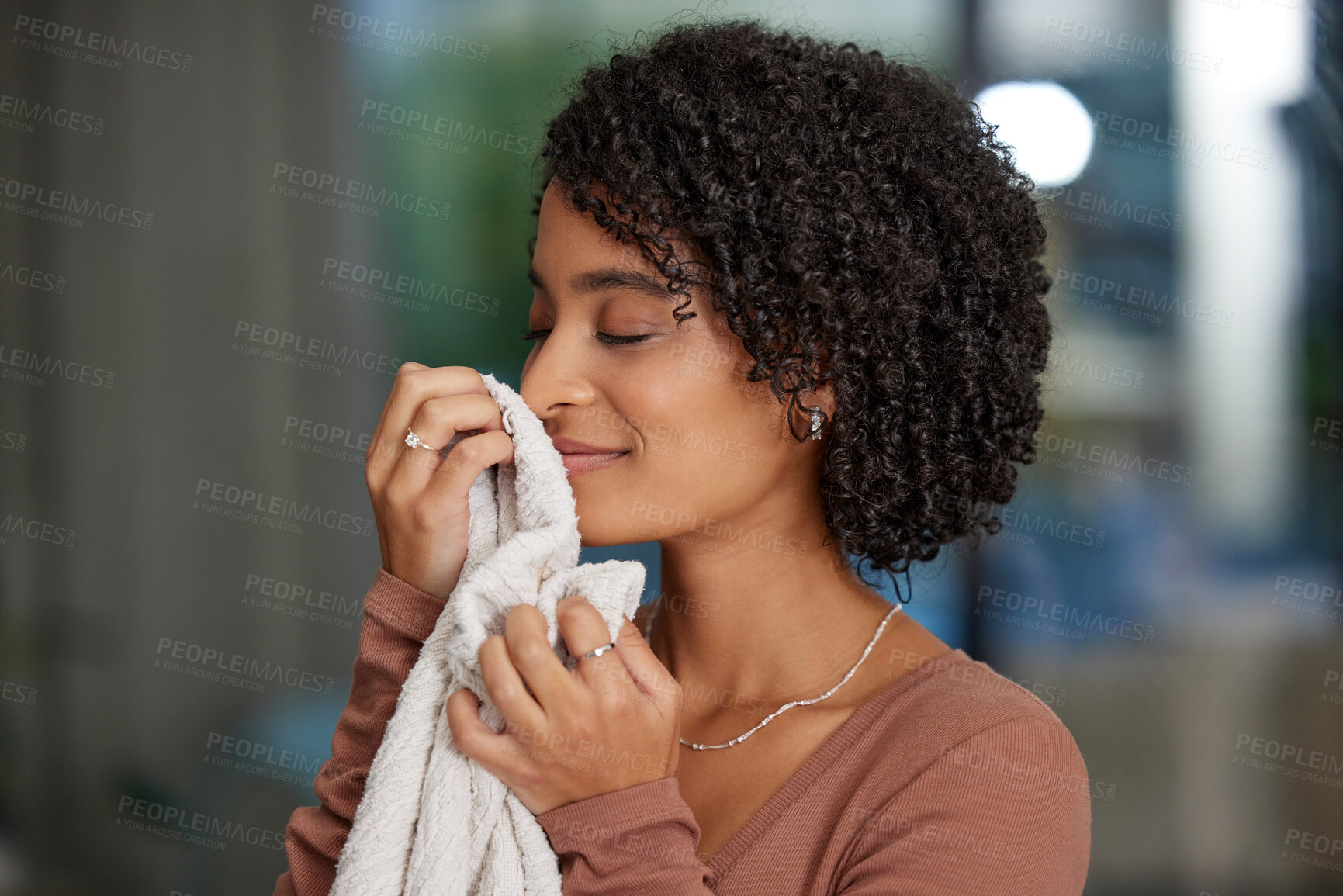 Buy stock photo Clean, towel and woman with smelling in home for fresh aroma, maintenance and fragrance of fabric. Peace, smile and female person with cloth in house for linen, scent and happiness in spring cleaning