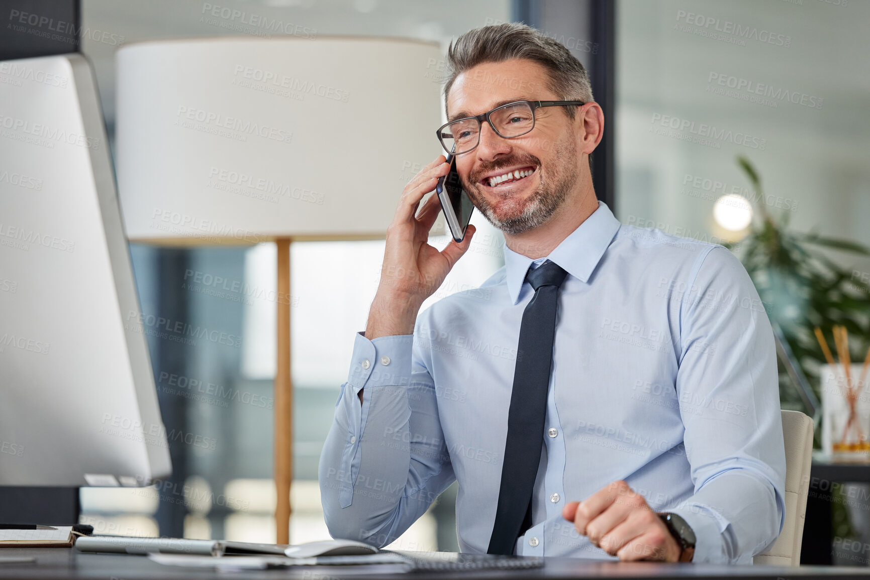 Buy stock photo Phone call, businessman and desk in office, talk and conversation for account advice. Virtual, communication and mature financial advisor on mobile with client, technology and workplace with computer