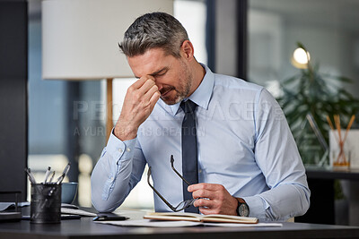 Buy stock photo Anxiety, headache or stress with business man at desk in office for audit, compliance or tax. Burnout, depression and mental health with mature employee in pain at corporate or professional workplace