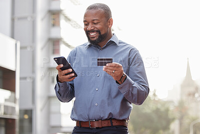 Buy stock photo Ecommerce, businessman with smartphone and credit card outside in the city happy. Online shopping, happiness with African male person with a cellphone and his bank information in urban street