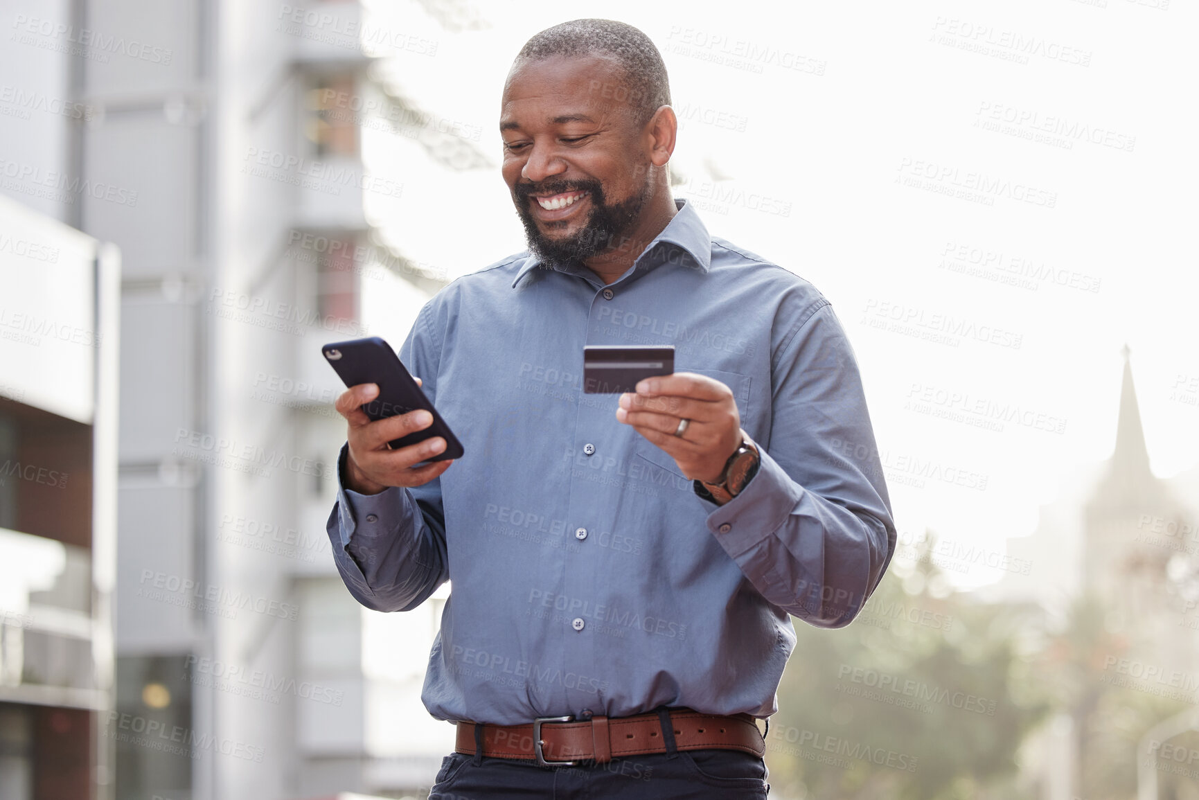 Buy stock photo Ecommerce, businessman with smartphone and credit card outside in the city happy. Online shopping, happiness with African male person with a cellphone and his bank information in urban street