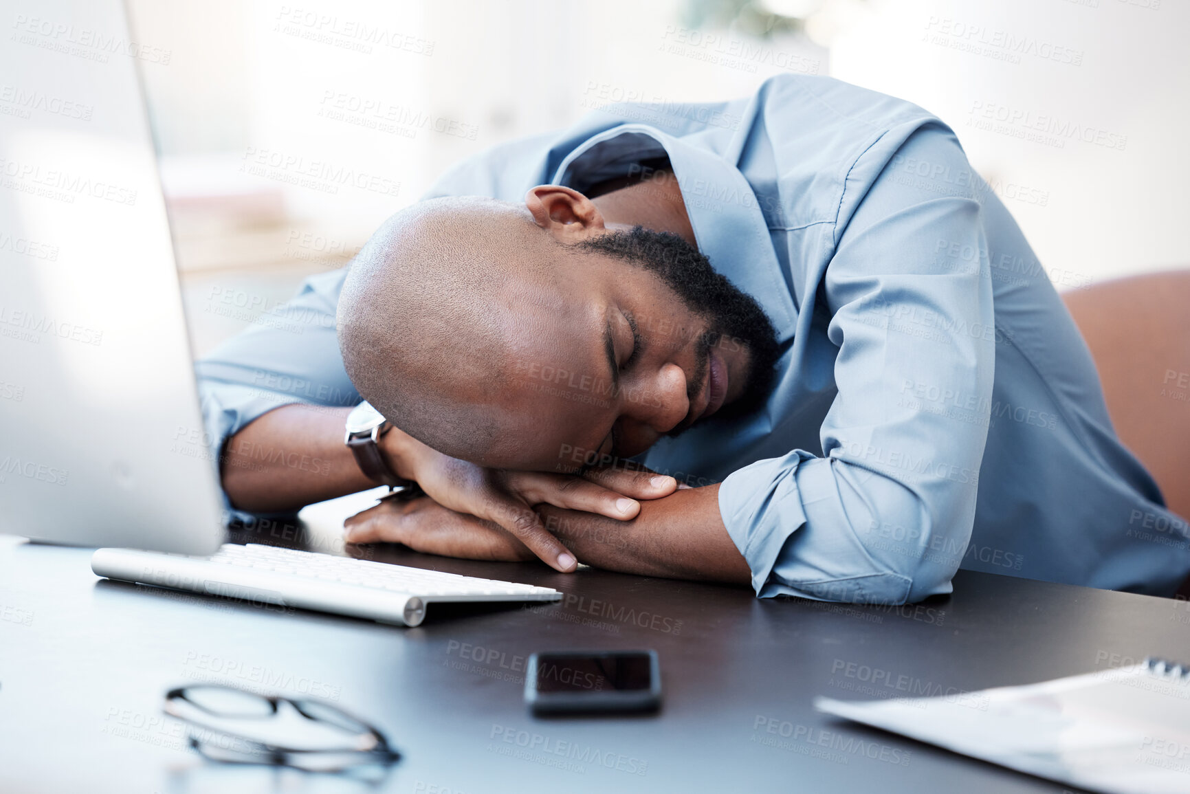 Buy stock photo Black man, sleeping and rest on desk, burnout and stress or anxiety in office for mental health. Male person, consultant and frustrated or dream of project deadline, nap and depression or fatigue