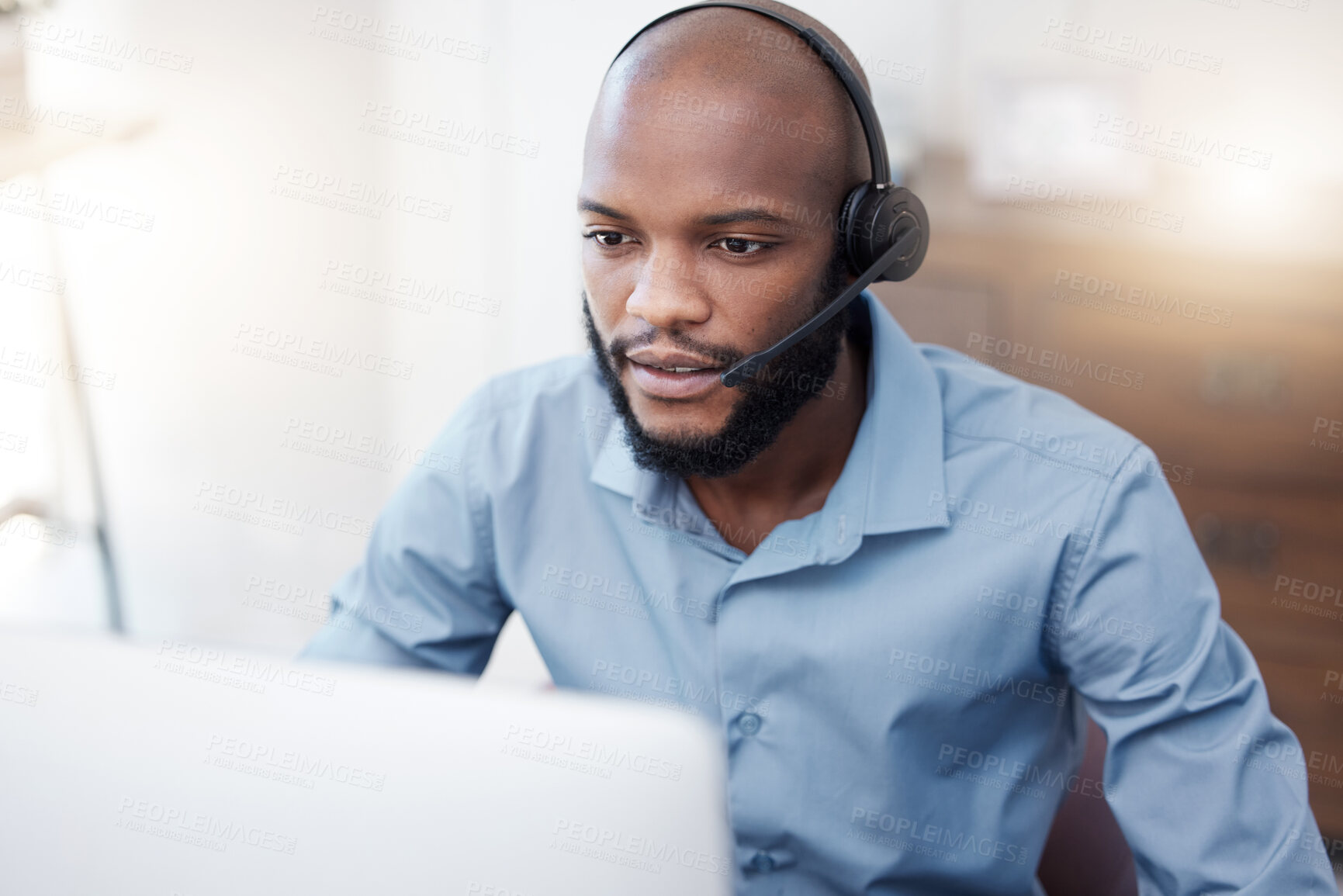 Buy stock photo Black man, call center employee and CRM with contact us, communication and computer, headset with mic and connect. Male consultant, customer service and tech support with help desk worker in office