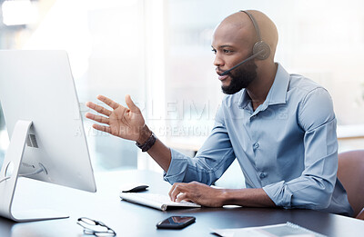 Buy stock photo Black man at computer, callcenter and contact us, phone call communication with headset and talking. Male agent in office, customer service and help desk employee with tech support and discussion