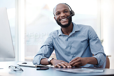 Buy stock photo Cropped portrait of a handsome young male call center agent working on his computer in the office