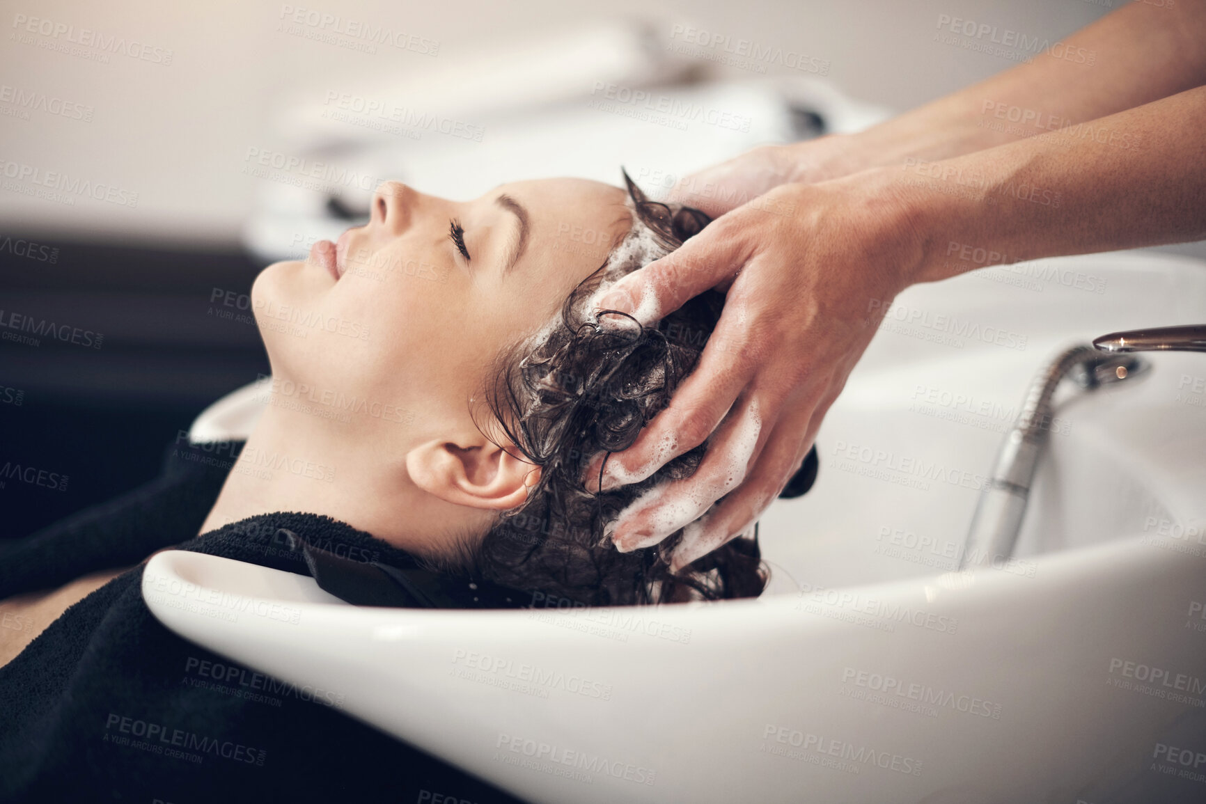 Buy stock photo Hands, massage and hairdresser with client in spa, relax and basin for wash and treatment. Soap, salon and hairstyle or cleaning for happy customer person, keratin or scalp shampoo for hair care