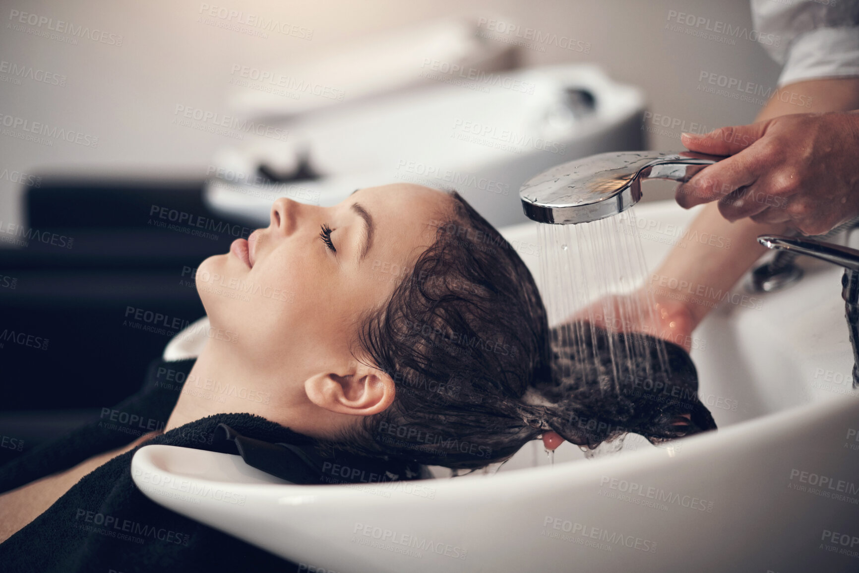 Buy stock photo Water, shampoo and hair care for client with hairdresser, salon and scalp treatment with massage. Basin, tap and washing with hands for dye hairstyle, relax and customer person for keratin service